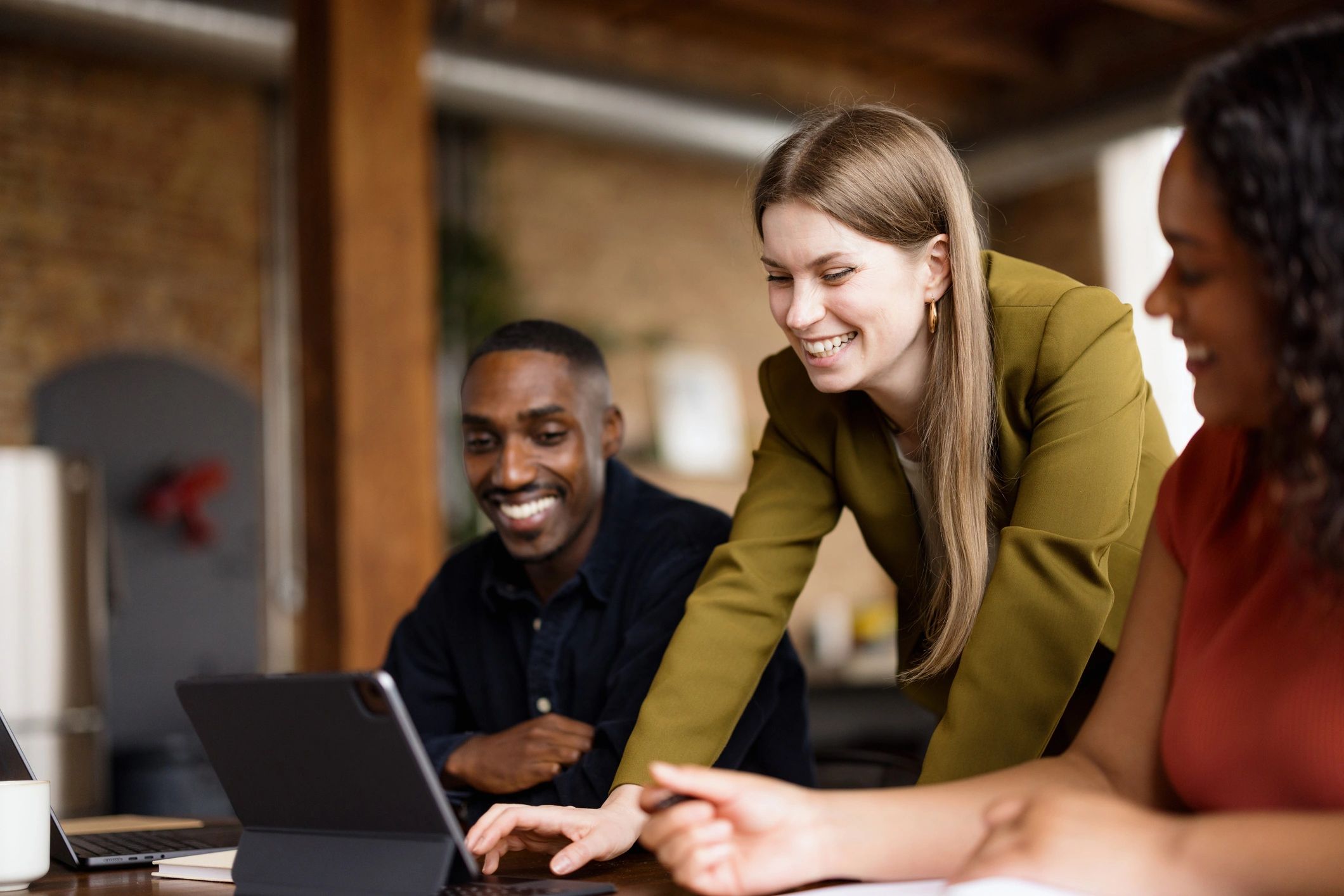 Software team collaborating in an office, representing onboarding and support.