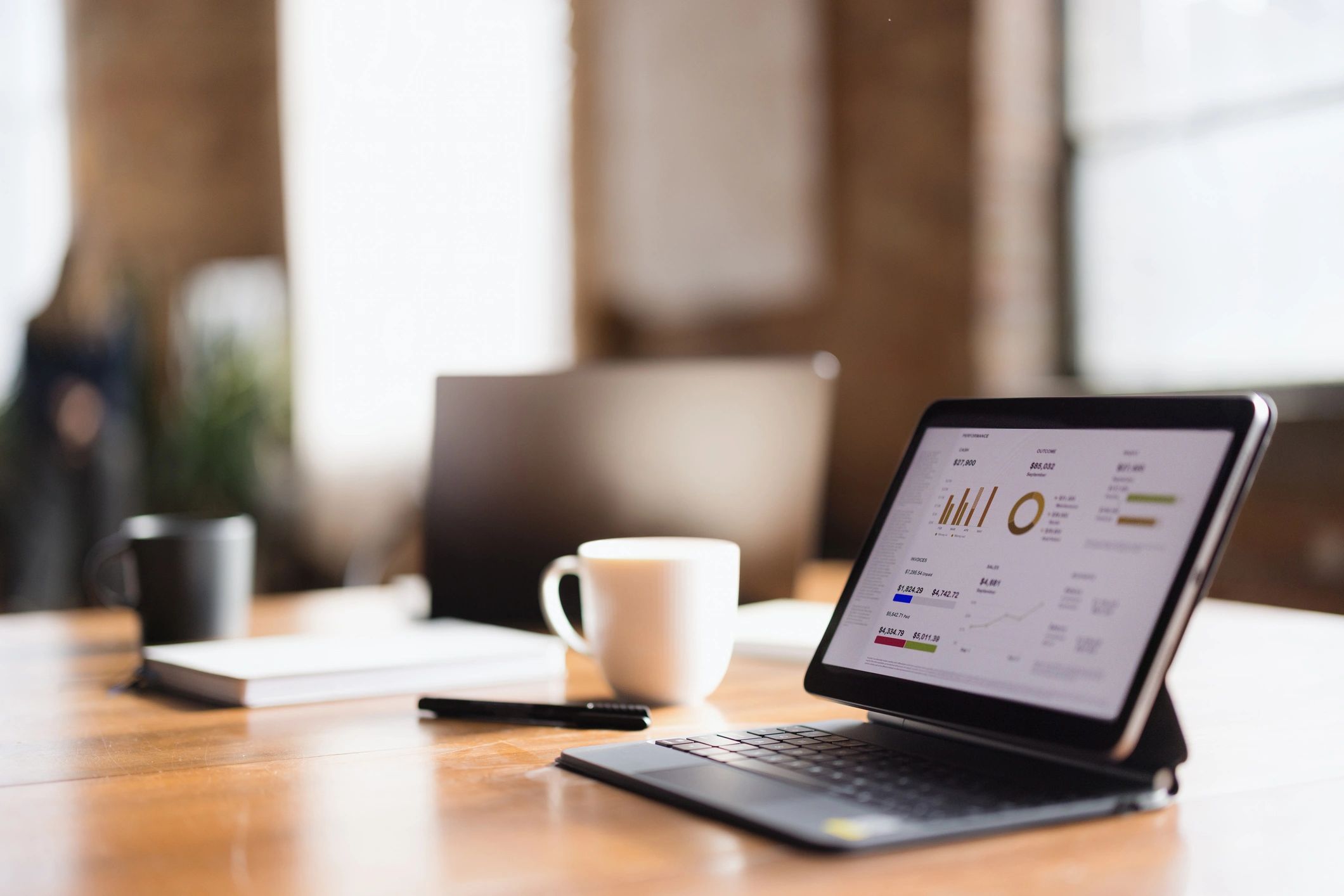 Tablet showing analytics dashboard, representing reporting and visibility.